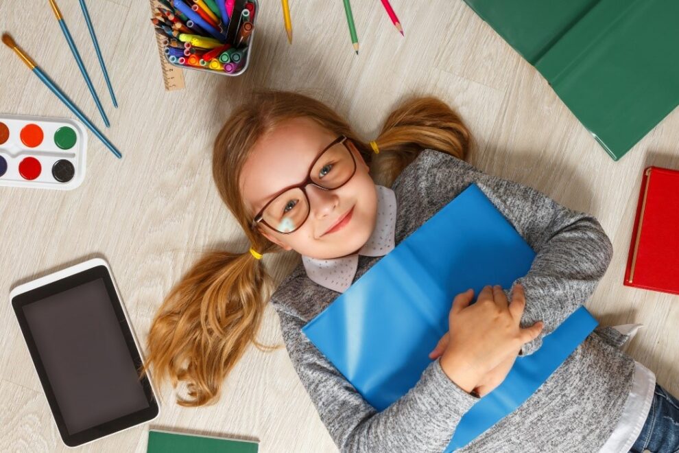 Little girl with glasses, ready for school